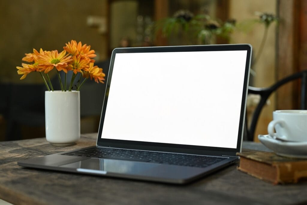 laptop computer with white empty screen coffee cu 2024 11 26 23 32 42 utc