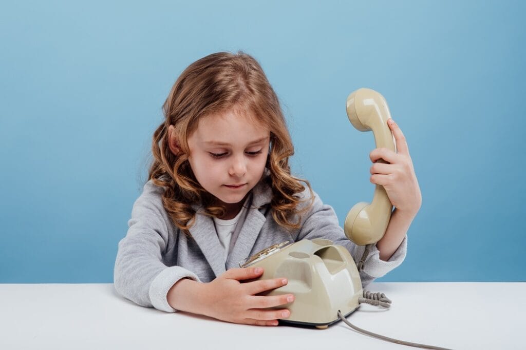 confused little girl with old telephone sitting a 2024 10 21 19 33 10 utc