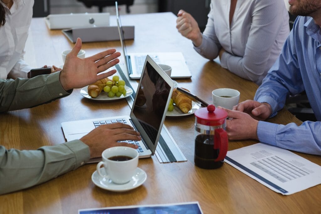 group of executives discussing with laptop and sna 2025 04 03 06 08 46 utc