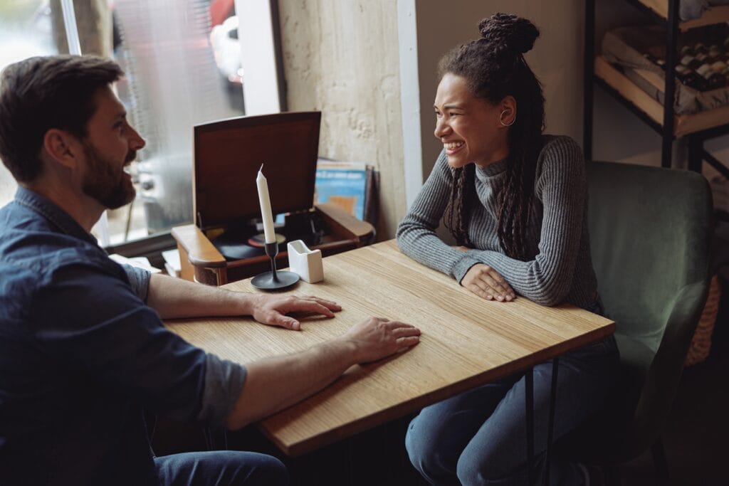 cheerful mixed races couple laughing and chatting 2024 10 18 08 08 30 utc 1