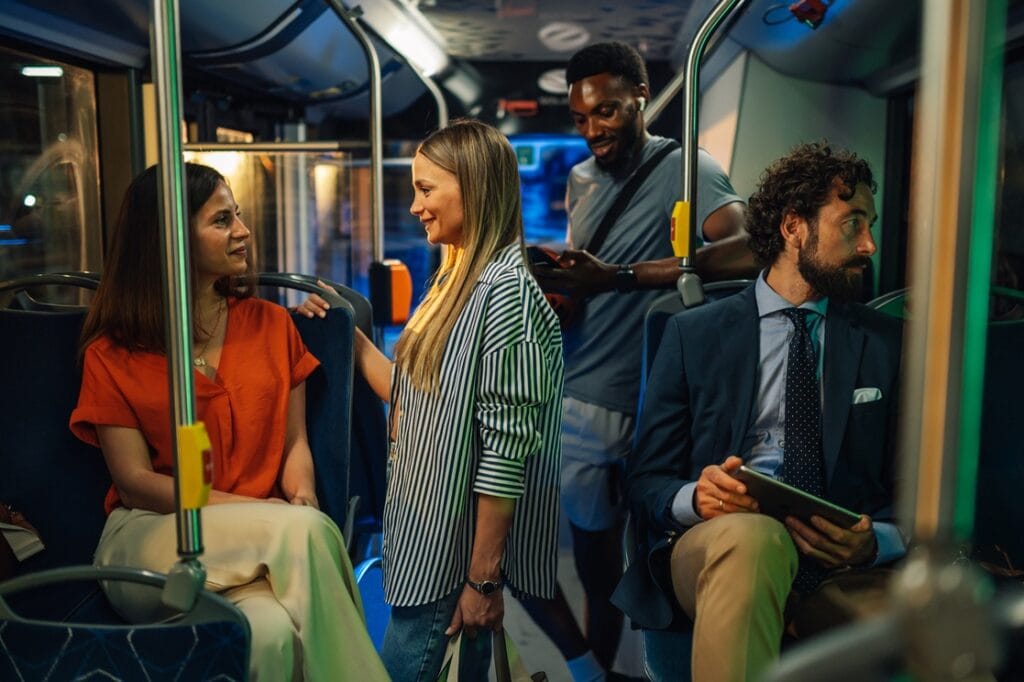 passengers chatting on a moving bus at night 2025 07 06 09 47 58 utc