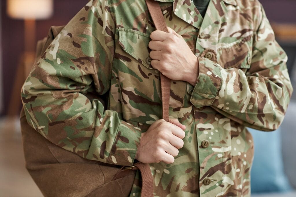 military man holding backpack 2025 03 07 12 17 15 utc
