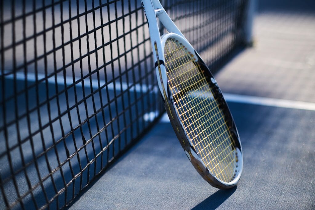 tennis racquet is standing near tennis net 2025 01 25 22 02 28 utc