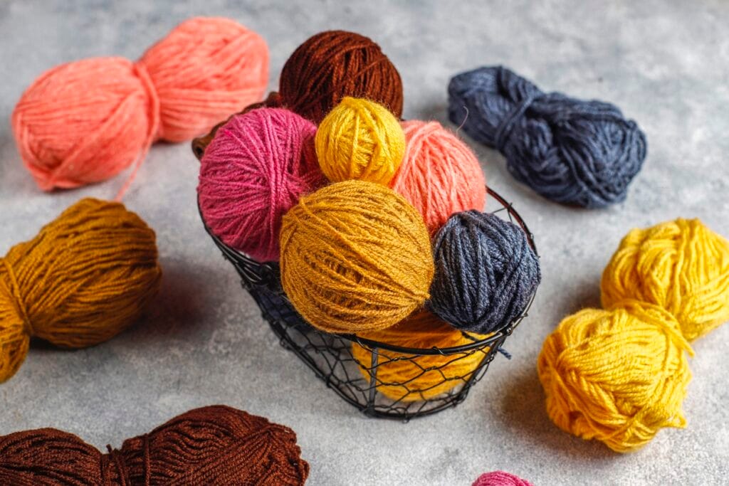 balls of yarn in different colors with knitting ne 2025 02 10 03 48 44 utc