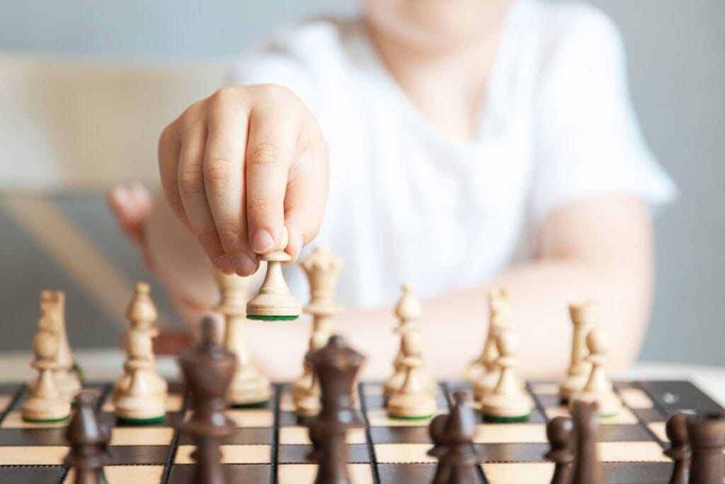 close up of a chess piece in the hands of a child 2026 03 17 05 06 28 utc