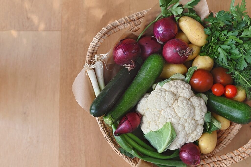 a large basket of fresh bio vegetables on a wooden 2026 01 06 09 36 53 utc