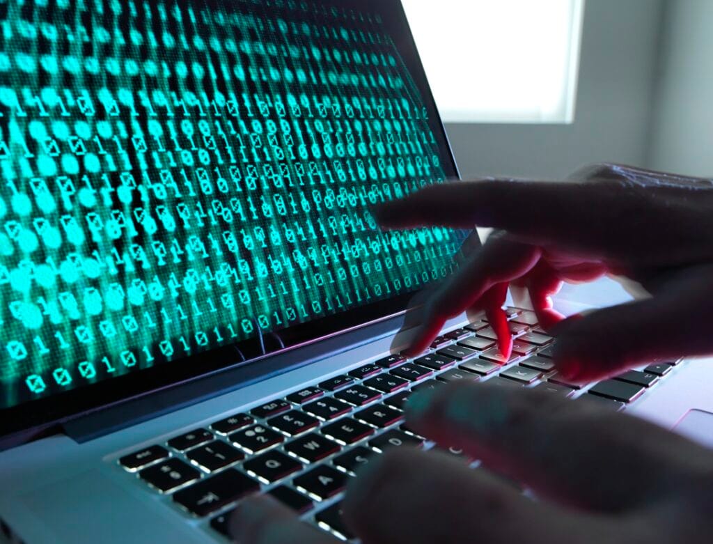 fingers typing on laptop screen displaying binary 2026 01 09 10 01 27 utc