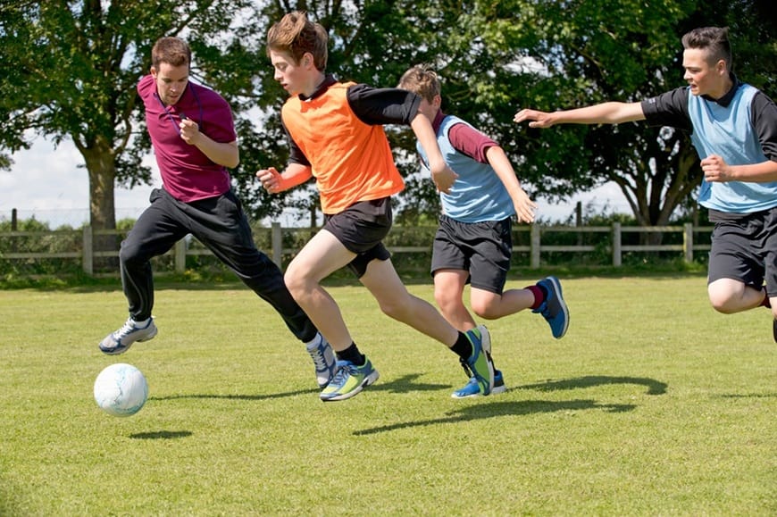 middle schoolboys and teacher running while playin 2026 01 11 09 39 16 utc