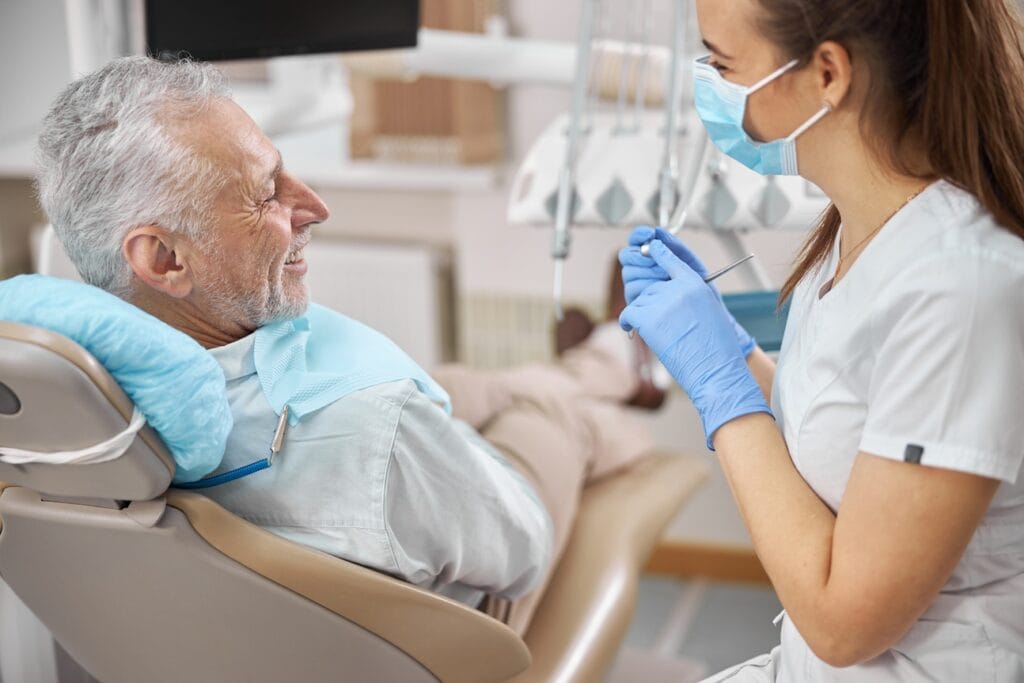 senior man at the dentist having checkup 2026 03 19 22 58 15 utc