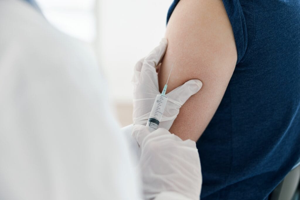 arm injection given by person in white coat 2026 03 24 05 31 24 utc