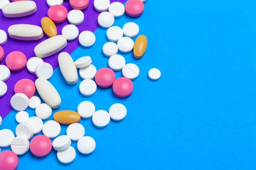 pills and capsules on colorful background 2026 03 19 07 57 59 utc