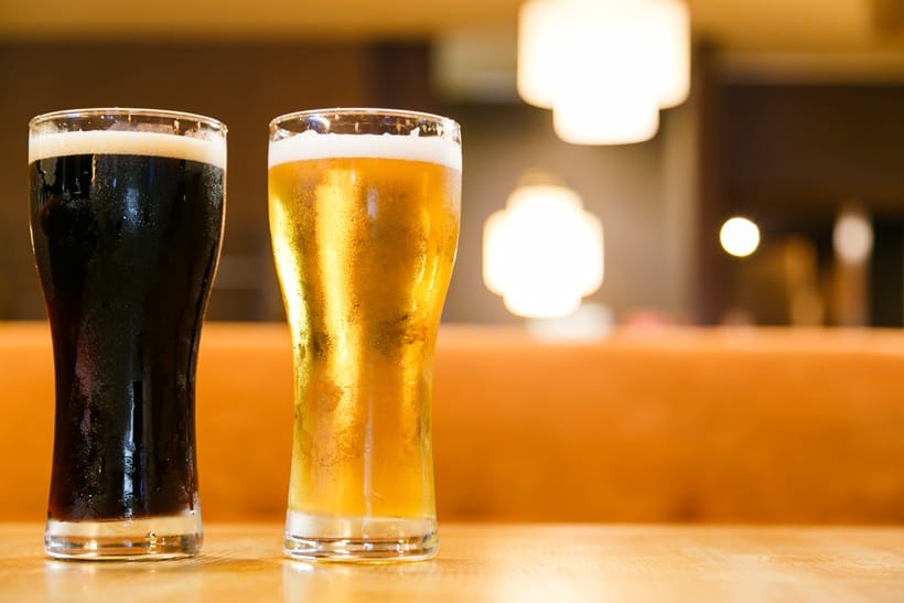 two glasses of beer on a wooden table 2026 03 19 04 01 38 utc
