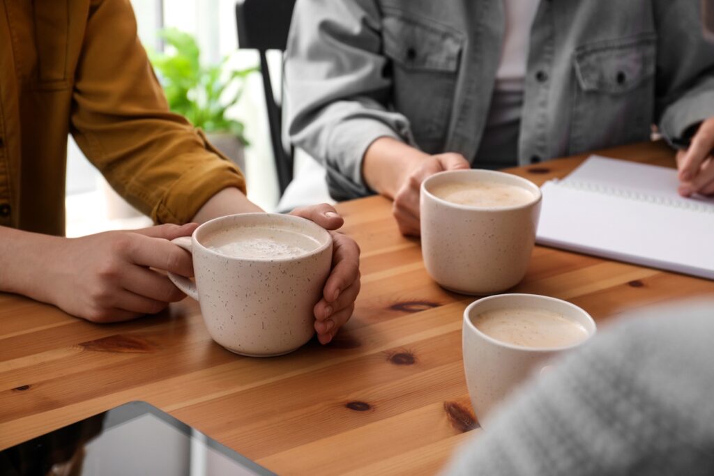 coffee meeting at wooden table with beverages 2026 09 25 01 23 46 utc